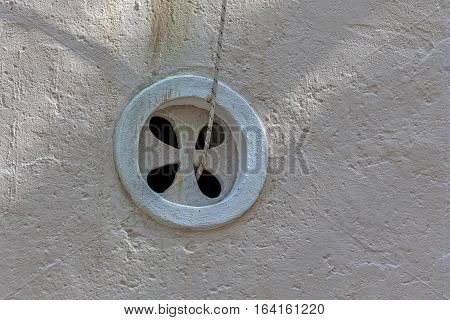 St. Roko church rosette detail in old village Tucepi in Dalmatia.