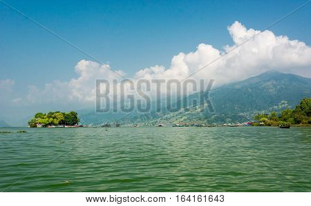 Landscape of green lake with island. Taal Barahi Temple on Lake Phewa, Pokhara in Nepal.