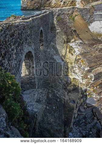 Gastelugache -  island on  coast of  Bay of Biscay belonging to  municipality of Bermeo, Basque Country.  Island is connected to  mainland by  man-made bridge that goes into  winding staircase that spans 237 degrees.