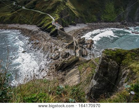 Gastelugache -  island on  coast of  Bay of Biscay belonging to  municipality of Bermeo, Basque Country.  Island is connected to  mainland by  man-made bridge that goes into  winding staircase that spans 237 degrees.
