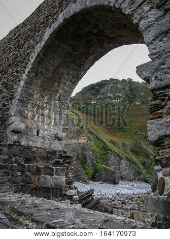 Gastelugache -  island on  coast of  Bay of Biscay belonging to  municipality of Bermeo, Basque Country.  Island is connected to  mainland by  man-made bridge that goes into  winding staircase that spans 237 degrees.