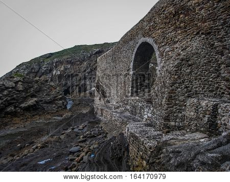 Gastelugache -  island on  coast of  Bay of Biscay belonging to  municipality of Bermeo, Basque Country.  Island is connected to  mainland by  man-made bridge that goes into  winding staircase that spans 237 degrees.