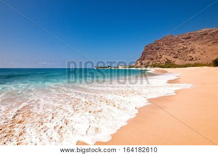 Wide angle view of Makaha Beach, the original surfing beach, on the northwest coast of Oahu, Hawaii