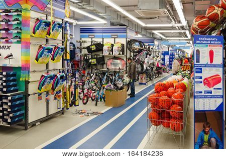 MOGILEV BELARUS - SEPTEMBER 28 2016: Unidentified people choose items for outdoor activities in sporting goods store 