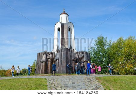 MINSK BELARUS - OCTOBER 1 2016: Unidentified people visit memorial complex "Monument to soldiers-internationalists" on Island of Tears Minsk Belarus