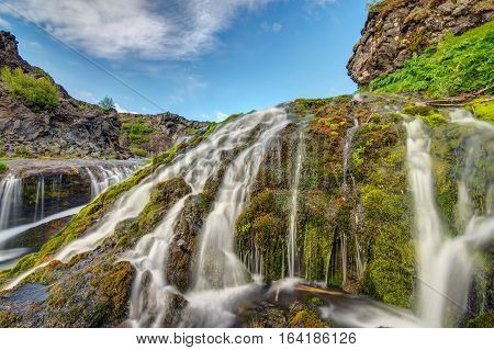 A small waterfall seen in the Gjain valley in Iceland