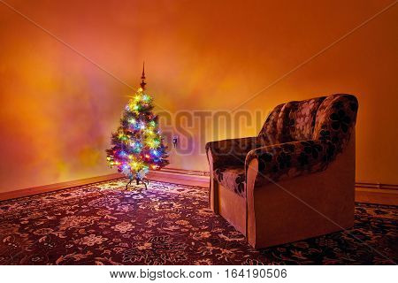 Chomutov Ustecky kraj Czech republic - shining Christmas tree and chair during Czech Christmas