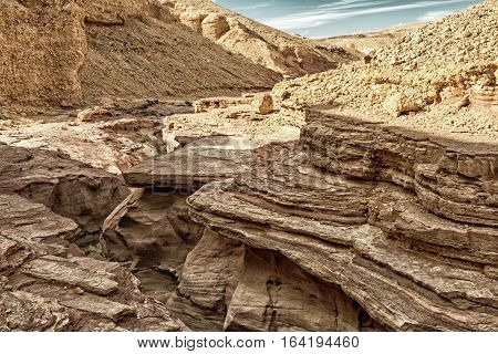 Detail of the Red Canyon tourist attraction in Israel (HDR image with black and gold filters)