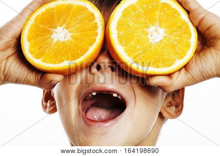 little cute boy with orange fruit double isolated on white smiling without front teeth adorable kid cheerful close up