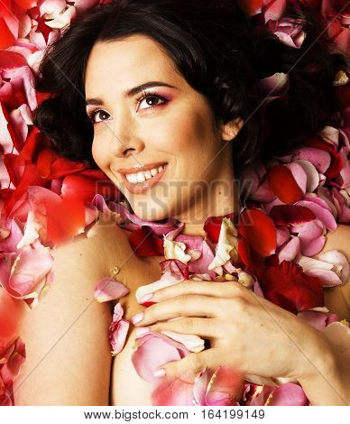 beauty young brunette woman with flower close up, rose petails spa close up