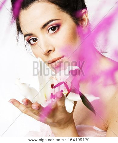 beauty young brunette woman with flower close up, rose petails spa close up