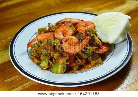 spicy stir fried wing bean with shrimp in curry on dish