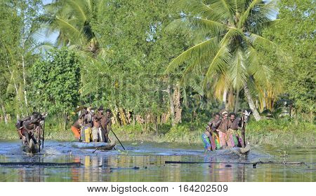 Indonesia, Irian Jaya, Asmat Province, Jow Village - June 23: Canoe War Ceremony Of Asmat People. He