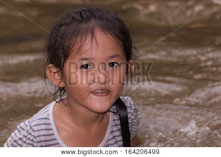 asia girl in river , thai children
