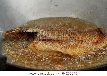 Cooking Of Deep Fried Nile Tiapia Fish.