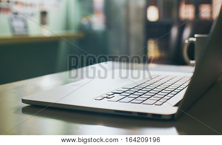 Coffee cup and laptop for business.close up Seleted focus.