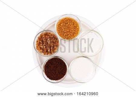 various type of Sugar in the cups white pure cane brown dark brown soft golden caster for background
