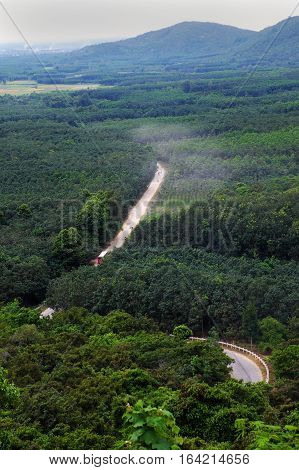 Dust Road Through Green  Jungle At Vietnam