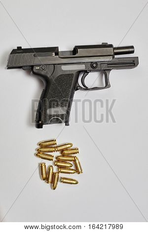 9 mm pistol gun and bullets isolated.