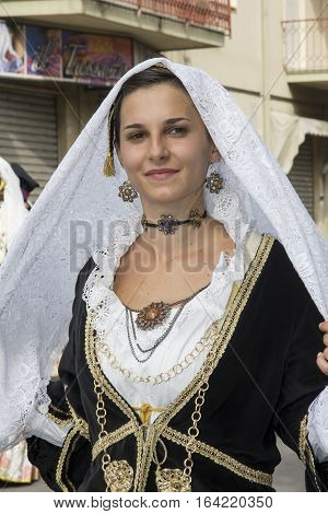 SELARGIUS, ITALY - September 8, 2013: Former marriage Selargino - Sardinia - portrait of a beautiful woman in traditional Sardinian costume