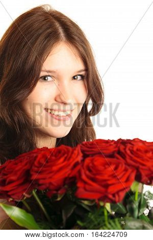 Studio shot of young woman holding bouquet of roses