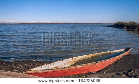 old wooden fishing boat in the lake Paliastomi Poti Georgia.