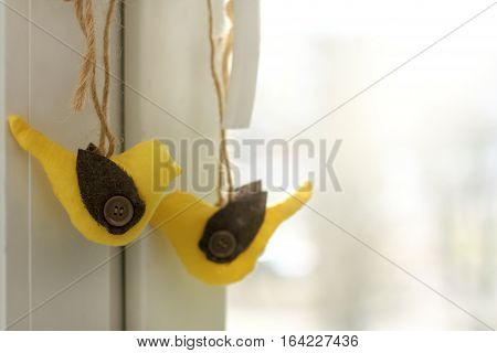pair of soft birds handmade decorated window / festive atmosphere of winter holidays