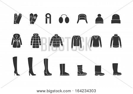 Winter clothes and shoes black icons set. Vector