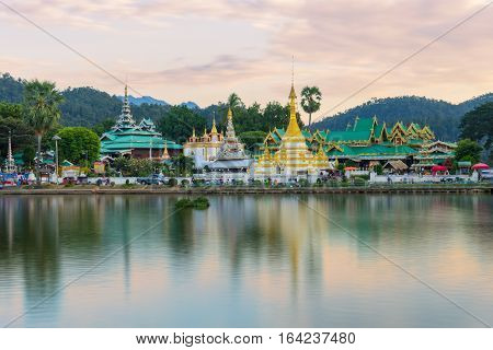 Sunset scence of Wat Jongklang temple - Wat Jongkham temple the most favourite place for tourist in Mae hong son near Chiang mai Thailand with reflect sky in water