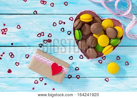 Background Valentine's Day. Valentine's Day Or Birthday Gifts Makarons Cake With Heart On A Blue Woo