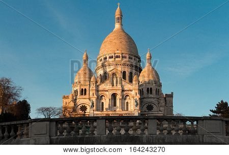 The basilica Sacre Coeur is a Roman catholic church located at the summet of the butte Montmartre the highest point in Paris.