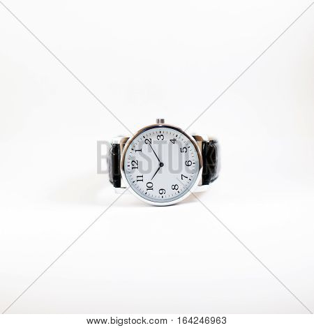 Minimalistic men's watch closeup isolated on white background. Wrist Watch.