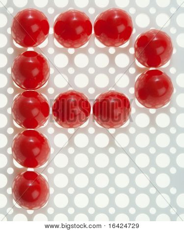 Font fatta di piastrelle di mosaico rosso. Altre lettere sono anche nel mio portafoglio.