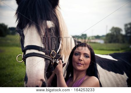 portrait of a young woman and her horse