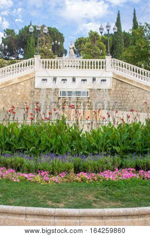 The statue of El Batallador in the Parque Grande Jose Antonio Labordeta with the colourful flowers in the foreground in Zaragoza, province Aragon, Spain