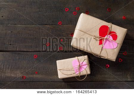 Background Valentine's Day. Valentine Day Day Or Birthday Presents With Paper Heart On A Wooden Tabl