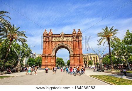 Barcelona, Spain - May 27, 2016: many tourists near the Arc de Triomphe in sunny summer day