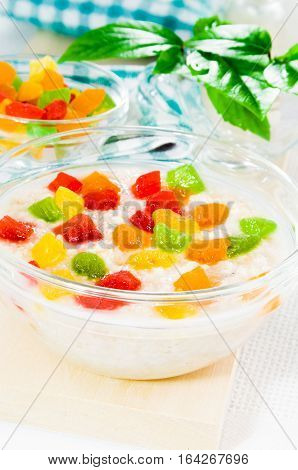 Oatmeal With Colorful Candied Fruits In A Glass Bowl