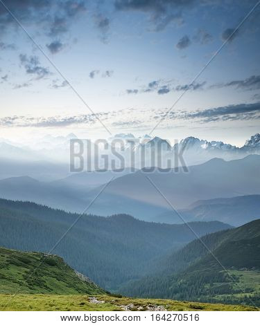 Hills during sunrise in mountain valley. Beautisul natural landscape