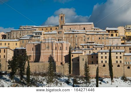 Winter view of Nocera Umbra medieval village covered by snow