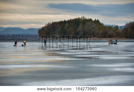 Men Ice Fishing on Lake Champlain in Late Afternoon
