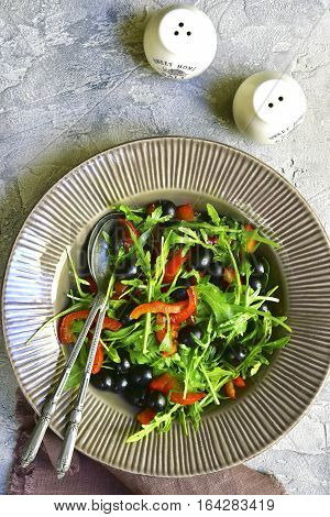 Salad With Arugula,black Olives And Grilled Bell Pepper.top View.