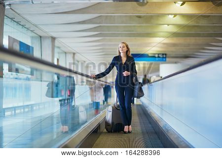 Woman On Travelator In The International Airport
