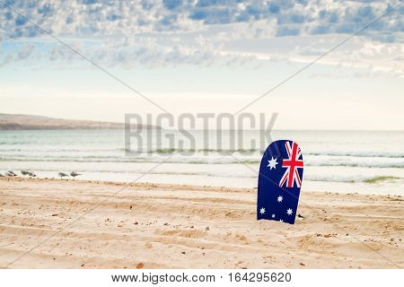Surfing board with Australian flag at the beach