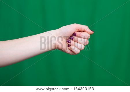 Female Fist Green Background