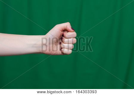Female Fist Green Background