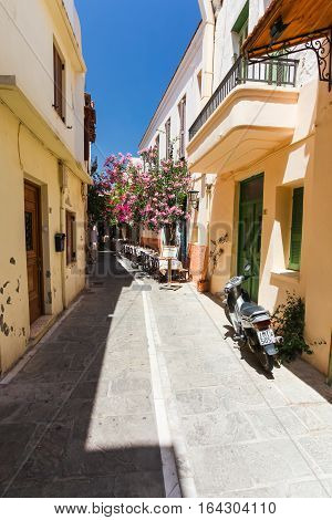 Rethymnon, Island Crete, Greece- July 1 2016: The narrow street of Rethymnon (part of Old Town) where there are a lot of small cafes and shops