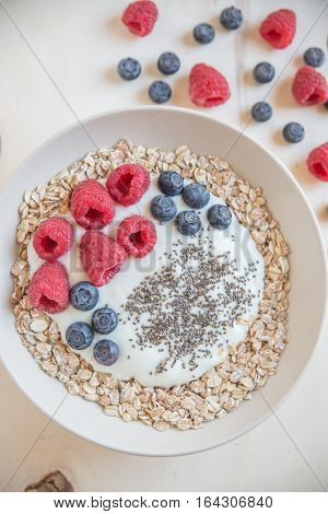 Yogurt with fresh berries and granola in a bowl