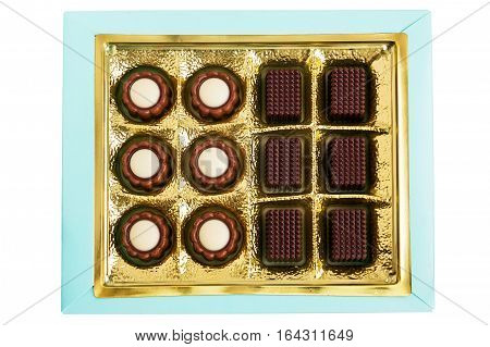 Chocolates in gold are in the box isolated on white background