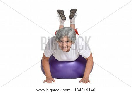 mature woman doing exercises, at the gym